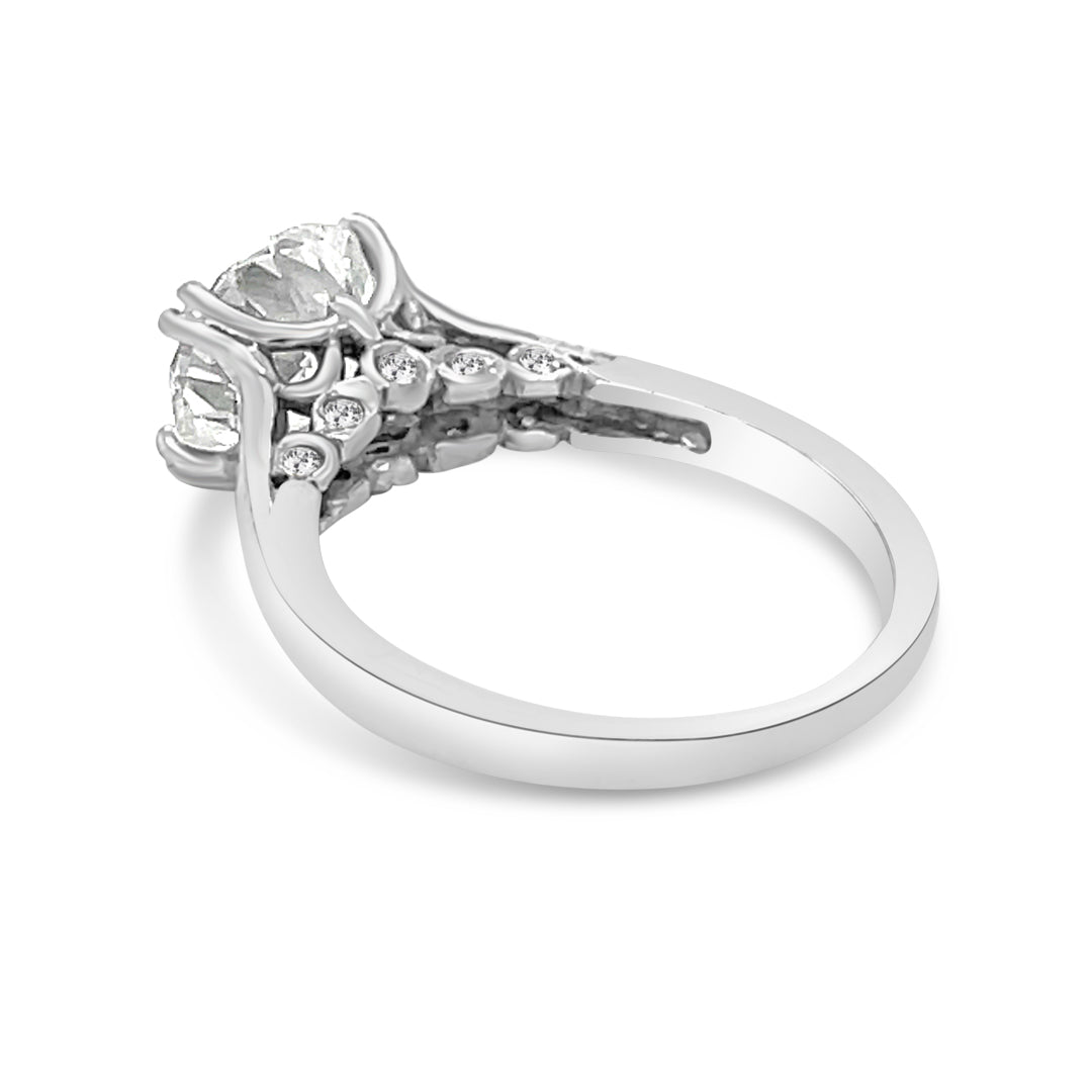 Solitaire Engagement Ring With Round Diamond and Decorated Bridge